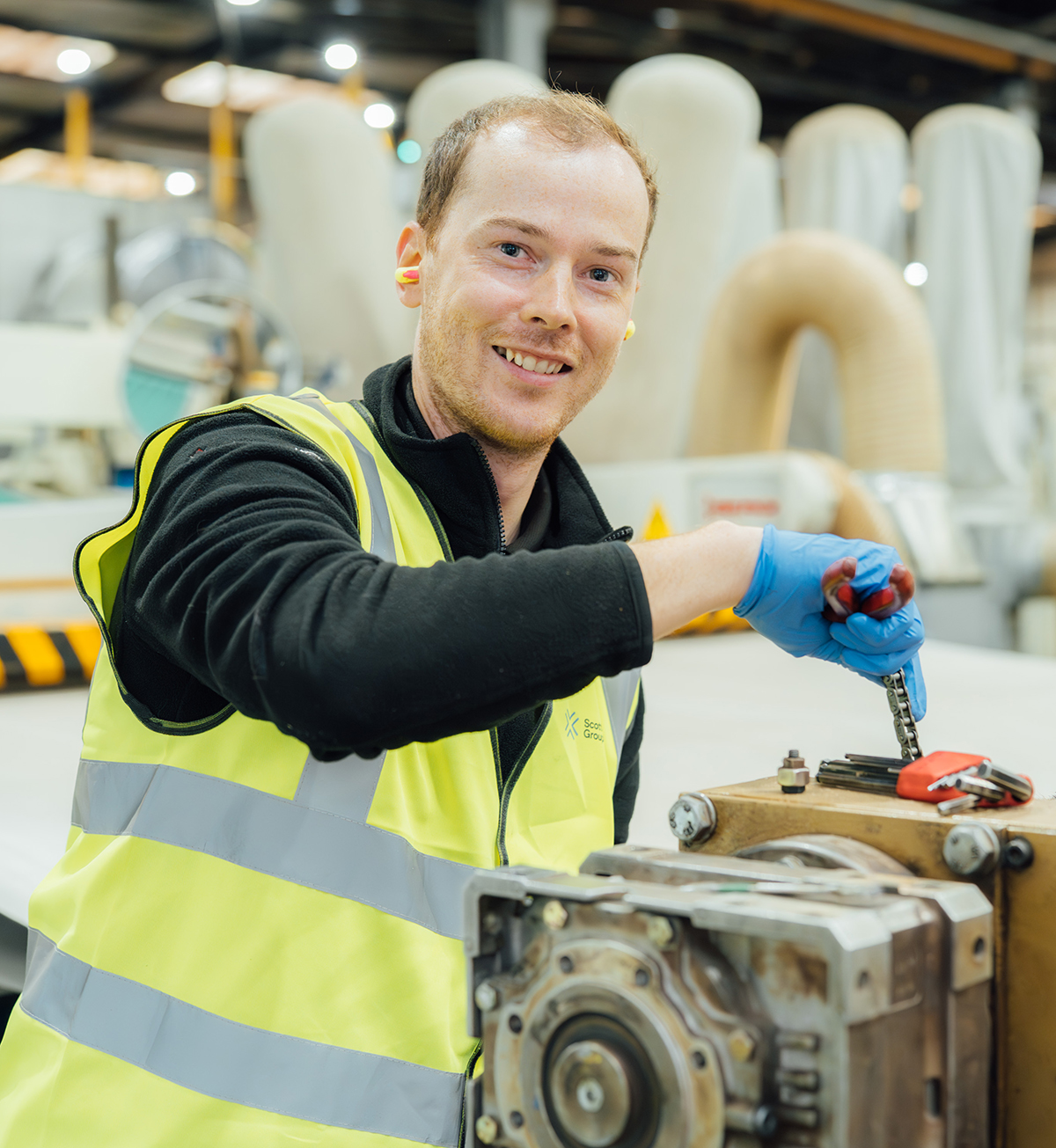 Young apprentice in factory space